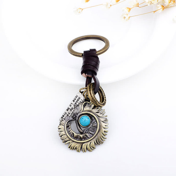 Porte-clés en cuir artificiel bleu turquoise avec queue de phénix