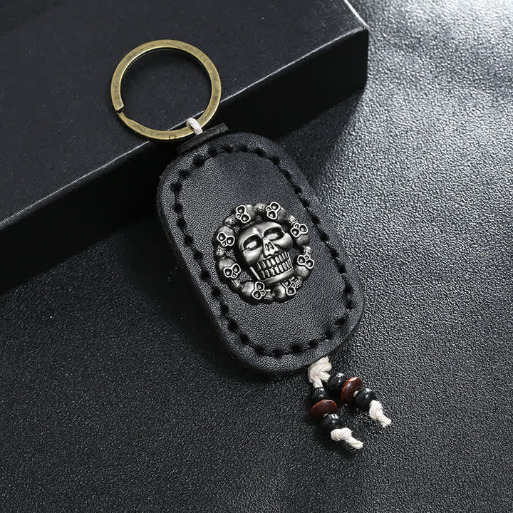 Porte-clés en cuir avec pendentif de style gothique en forme de crâne ovale