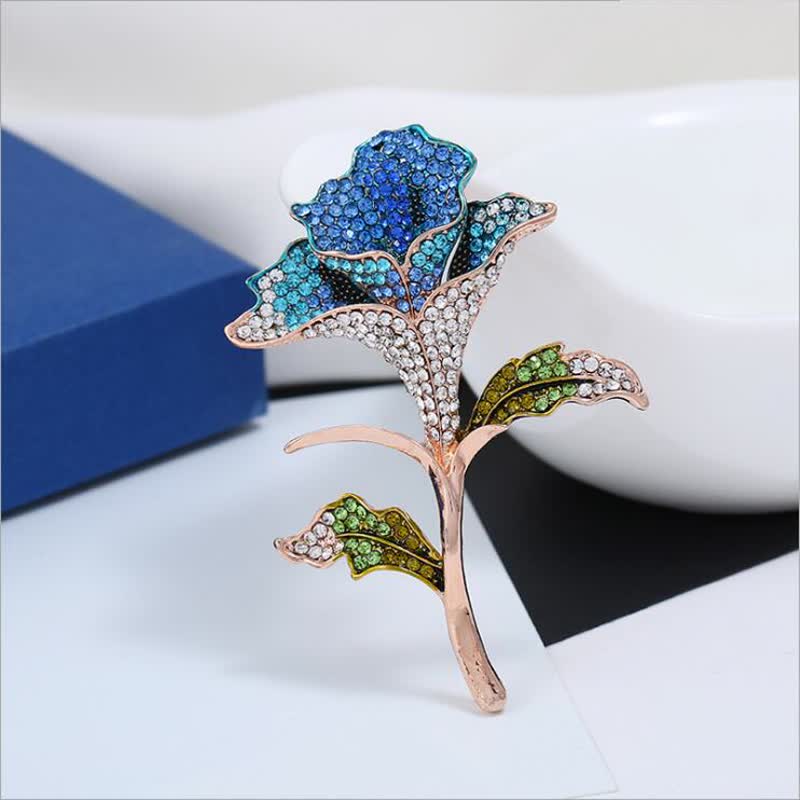 Broche gracieuse et charmante en strass avec fleur d'orchidée