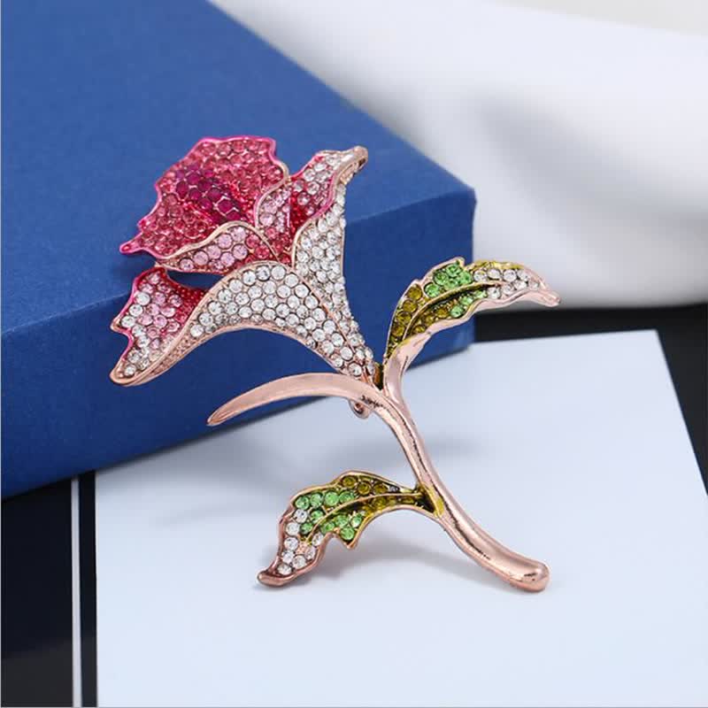 Broche gracieuse et charmante en strass avec fleur d'orchidée