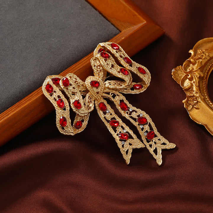 Broche fantaisie en forme de nœud papillon en ruban métallique ondulé doré pour femme