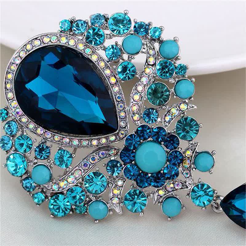 Broche en forme de goutte d'eau en verre transparent pour femme