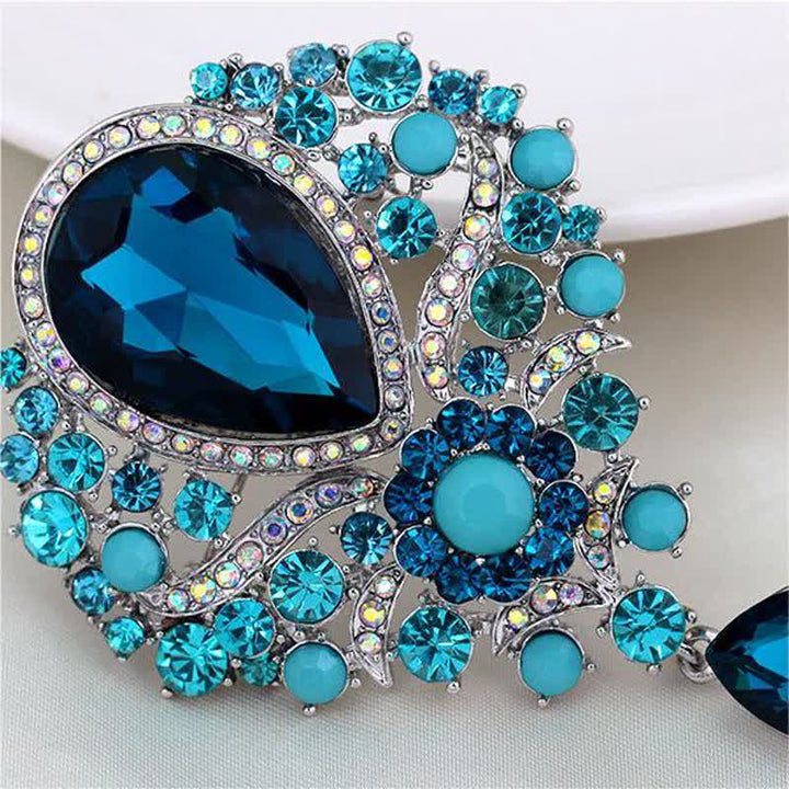 Broche en forme de goutte d'eau en verre transparent pour femme