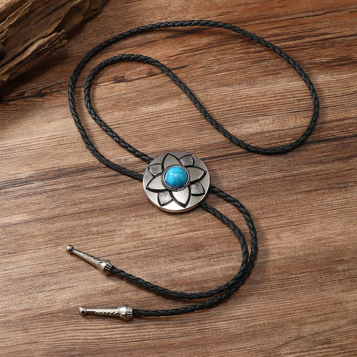 Cravate bolo en pierre turquoise noire à pétales ovales sculptés