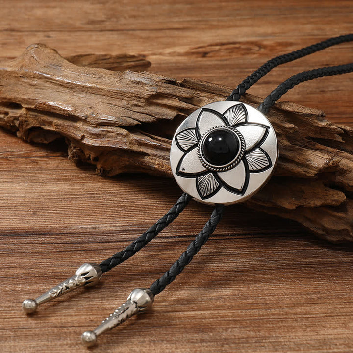 Cravate bolo en pierre turquoise noire à pétales ovales sculptés