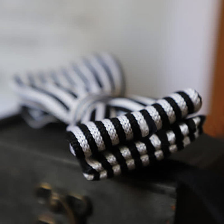 Nœud papillon à rayures en damier noir et blanc pour homme