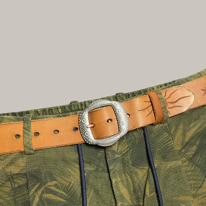 Ceinture en cuir avec boucle argentée et motif soleil rétro en relief