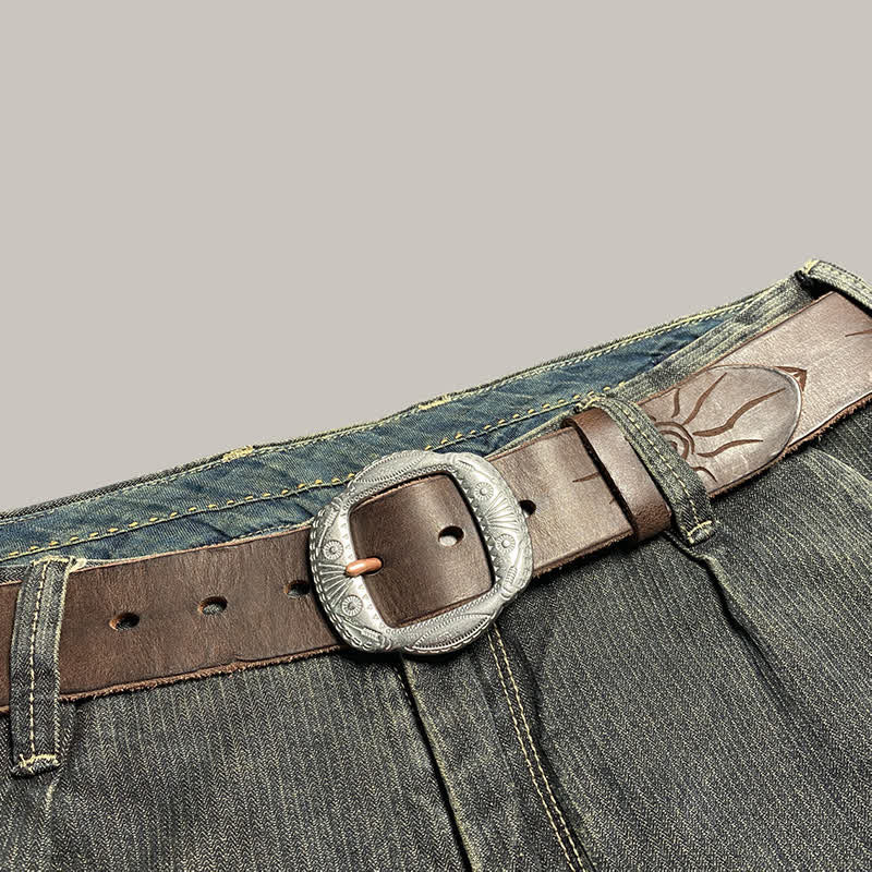 Ceinture en cuir avec boucle argentée et motif soleil rétro en relief