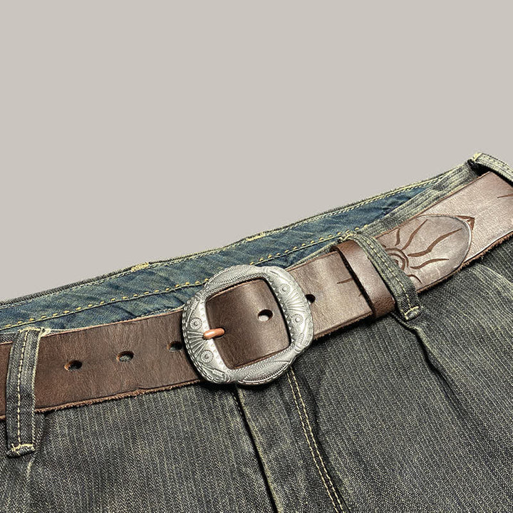 Ceinture en cuir avec boucle argentée et motif soleil rétro en relief