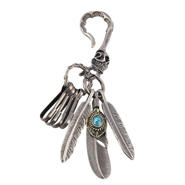 Porte-clés en cuir bleu turquoise avec plumes de crâne Boho