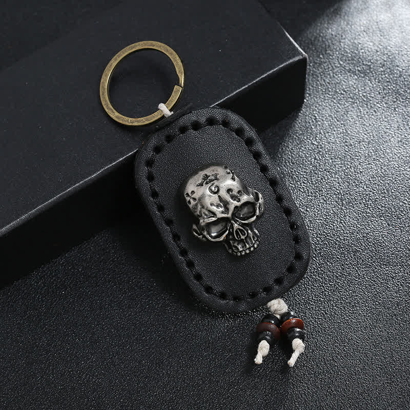Porte-clés en cuir avec pendentif en forme de crâne punk 3D