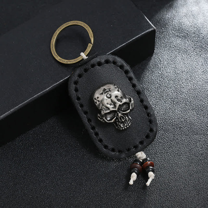 Porte-clés en cuir avec pendentif en forme de crâne punk 3D