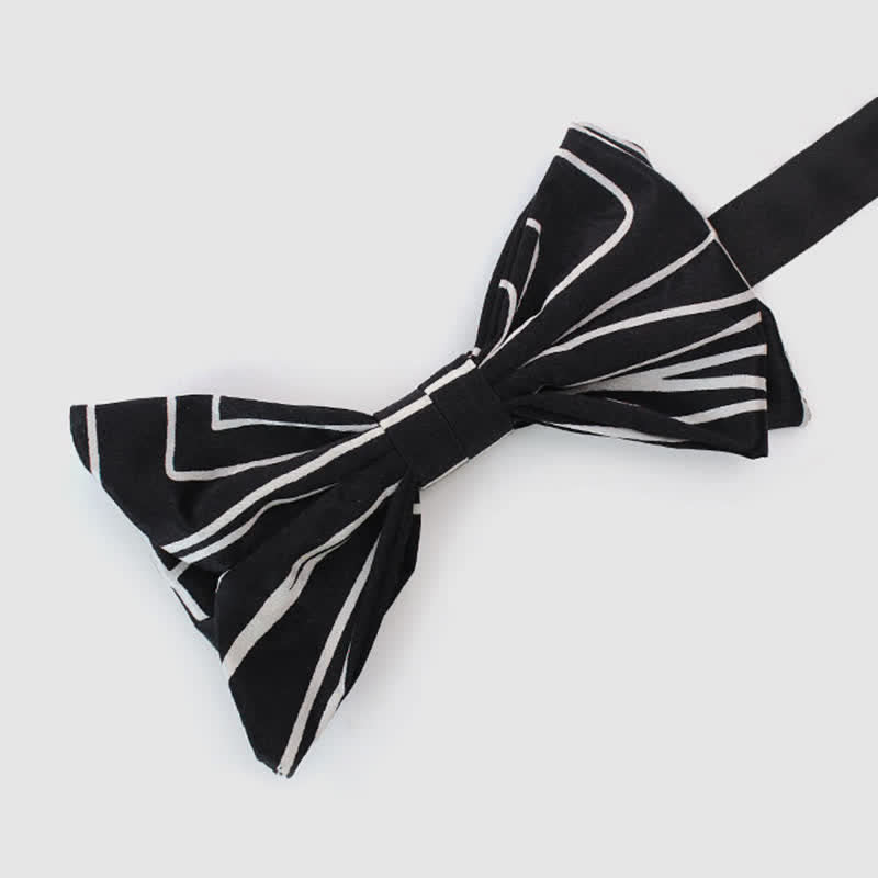 Nœud papillon noir et blanc à lignes géométriques pour homme