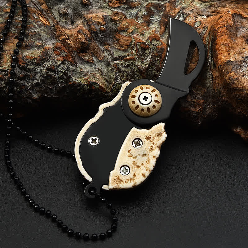 Collier porte-clés mini couteau pliant créatif avec chaîne et tête de mort