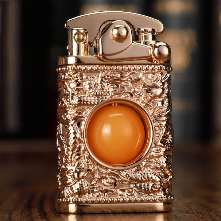 Briquet au butane rechargeable Dragon jouant avec une perle orange