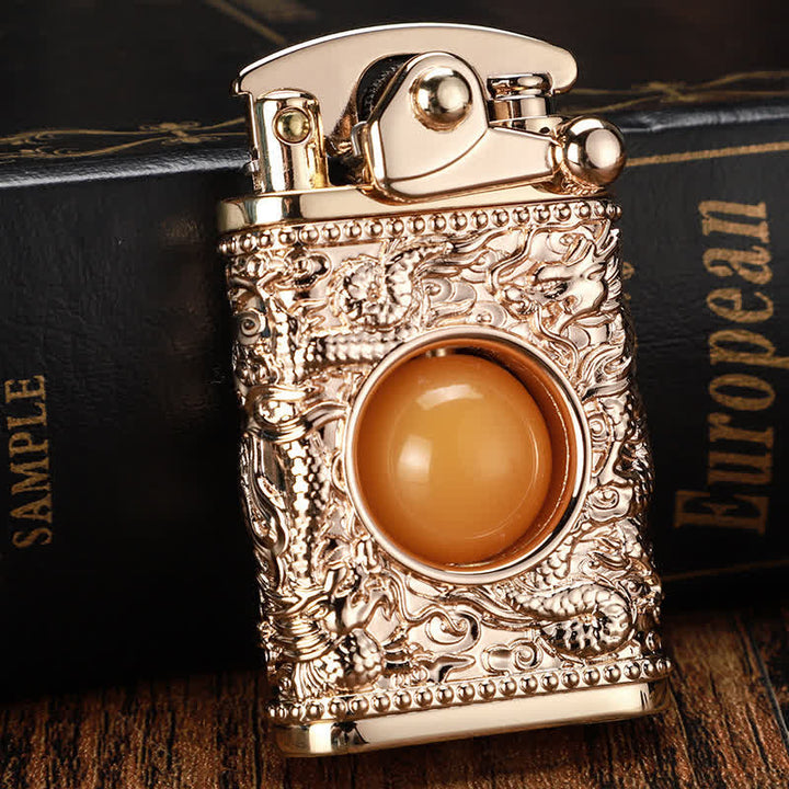 Briquet au butane rechargeable Dragon jouant avec une perle orange
