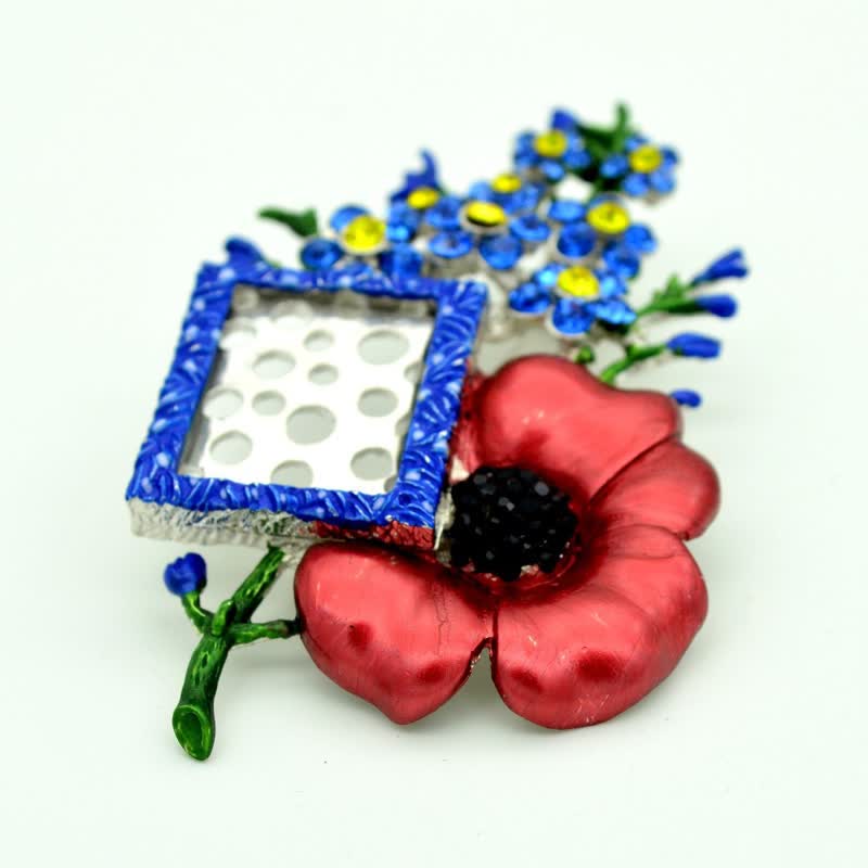 Broche fleur de pavot en strass avec cadre photo