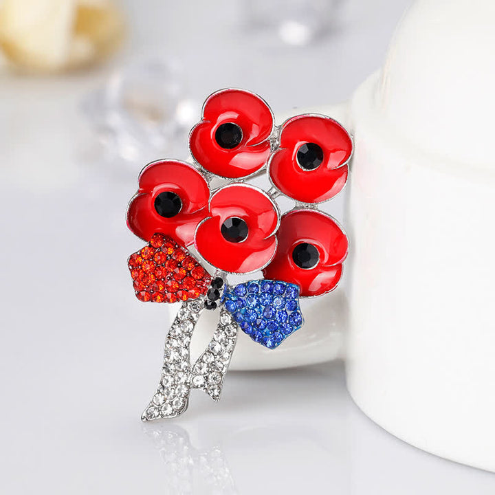 Broche fleur en strass avec noeud papillon et cinq coquelicots rouges