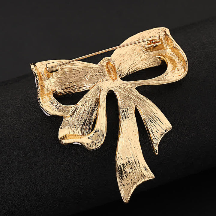 Broche en strass avec noeud papillon et drapeau américain