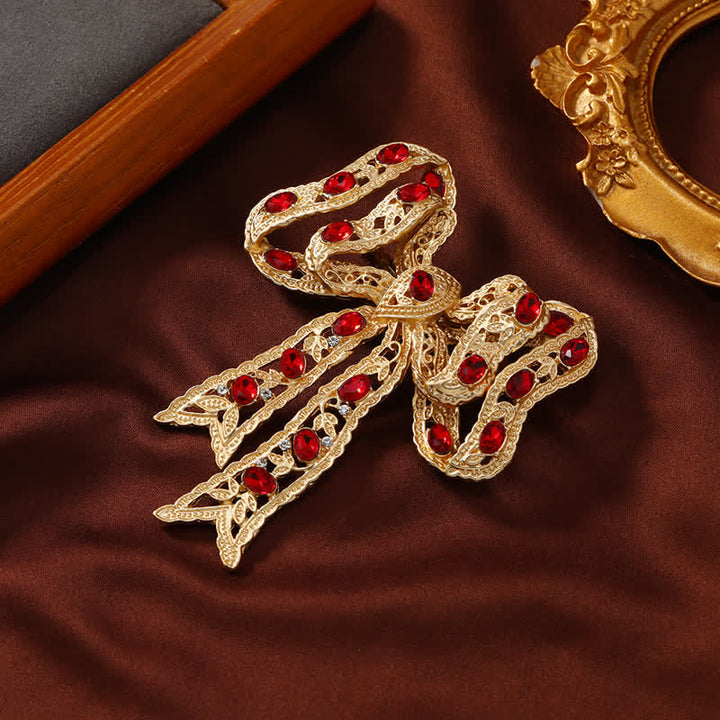 Broche fantaisie en forme de nœud papillon en ruban métallique ondulé doré pour femme