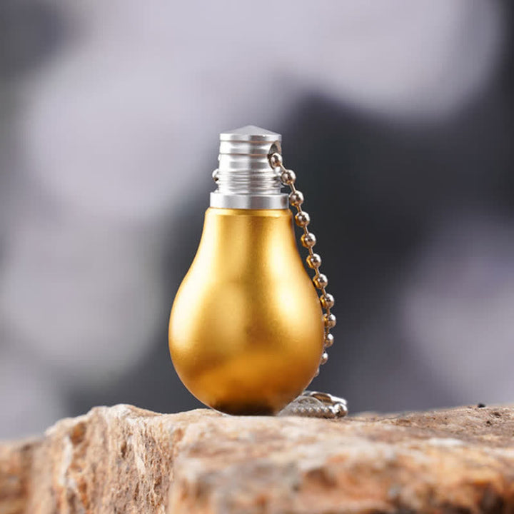 Porte-clés couteau caché en forme d'ampoule de lampe de couleur dorée