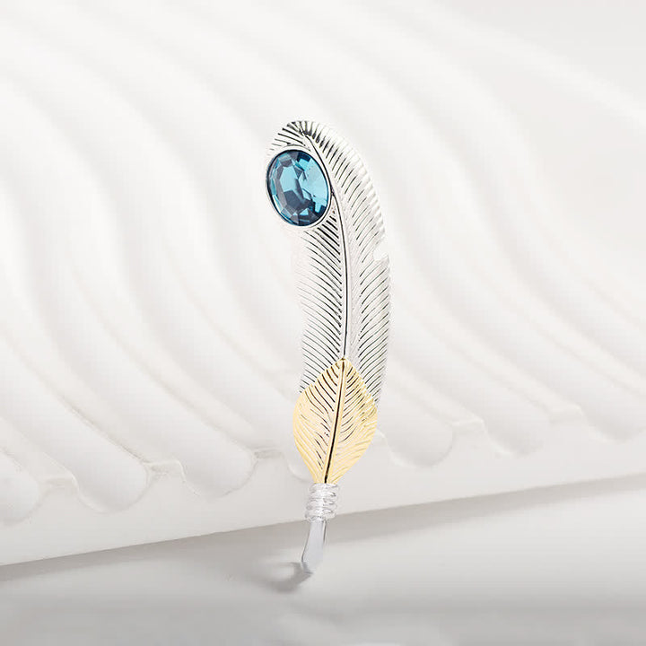 Broche unisexe en forme de plume avec faux cristal bleu