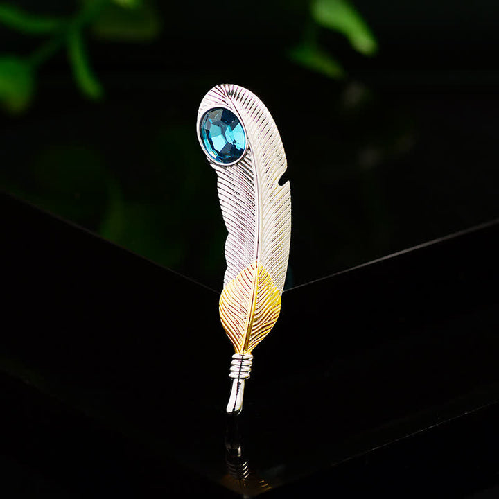Broche unisexe en forme de plume avec faux cristal bleu