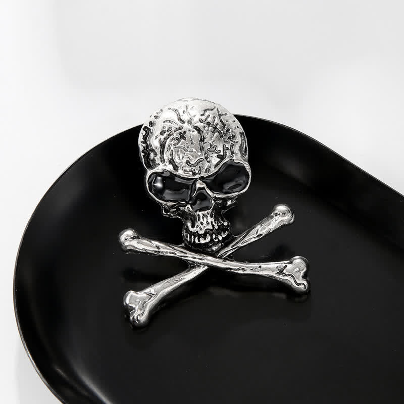 Broche décorative punk en forme de tête de mort et d'os croisés