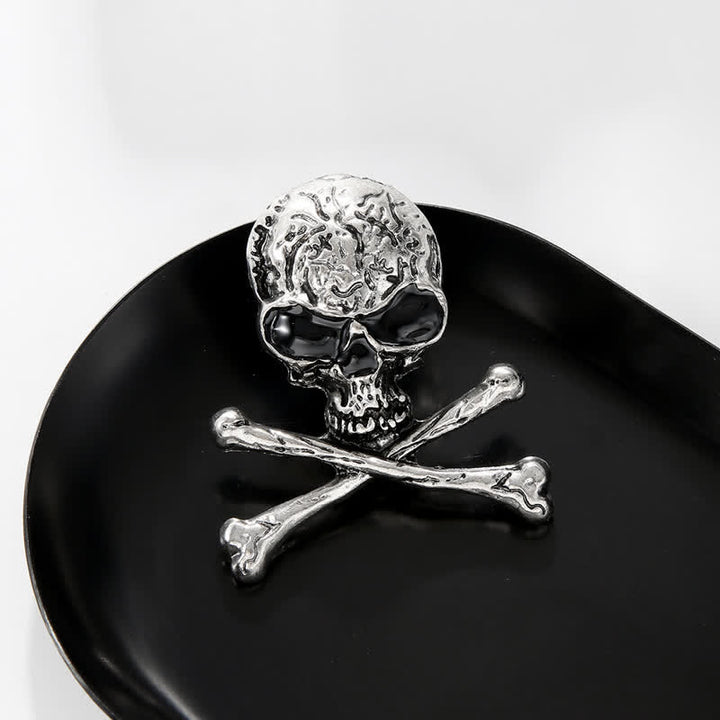Broche décorative punk en forme de tête de mort et d'os croisés