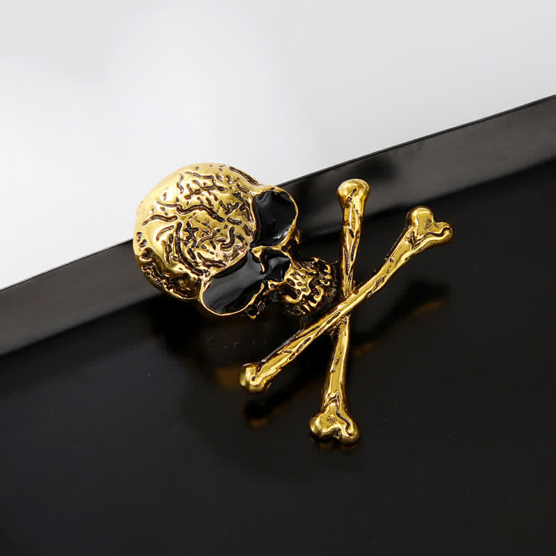Broche décorative punk en forme de tête de mort et d'os croisés