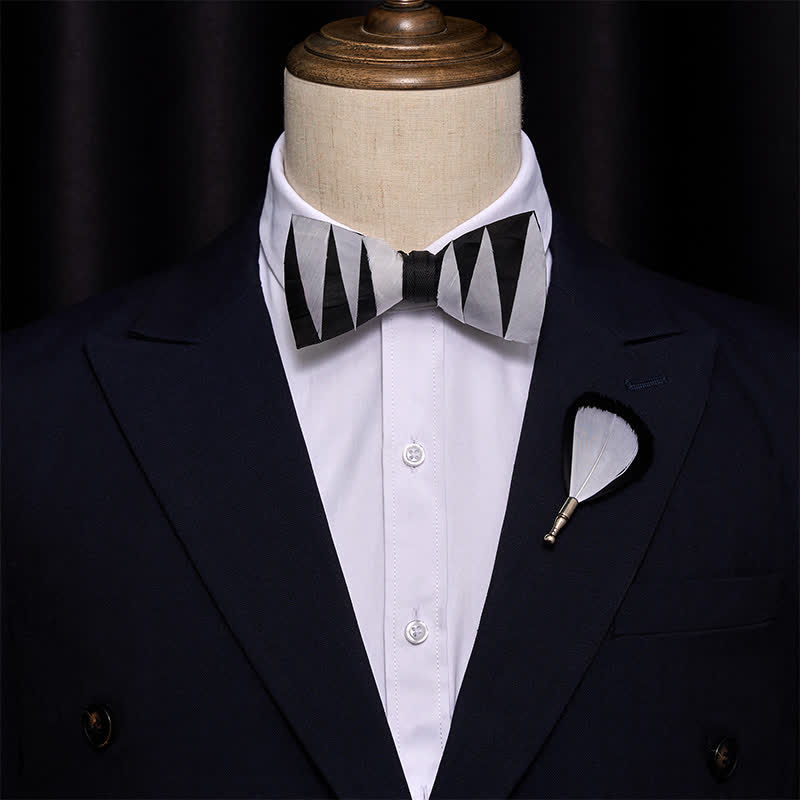 Nœud papillon à plumes blanches et noires avec épingle à revers