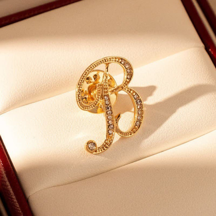Broche en strass avec initiale 26 en or