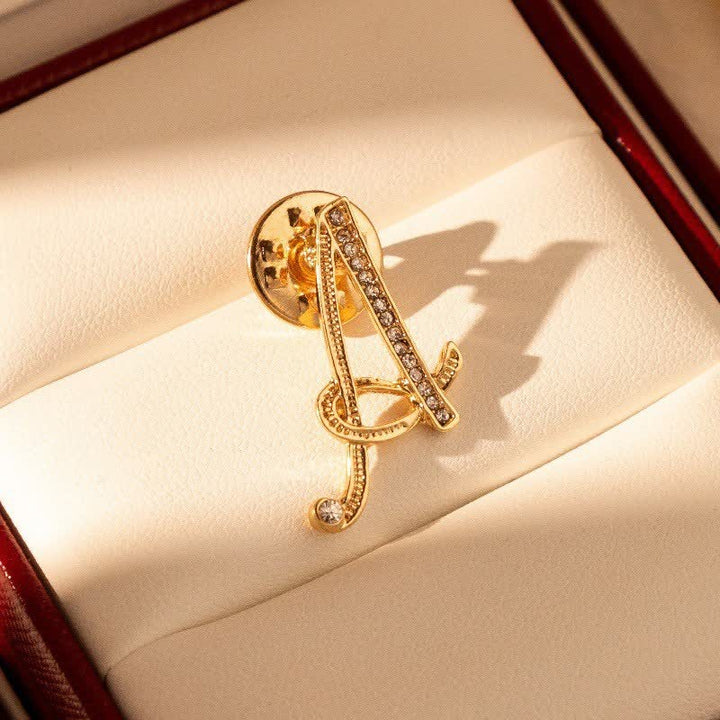 Broche en strass avec initiale 26 en or