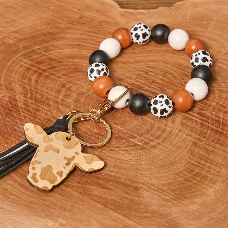 Bracelet western en perles de bois de vache avec pompon - Vache blanche - image 1