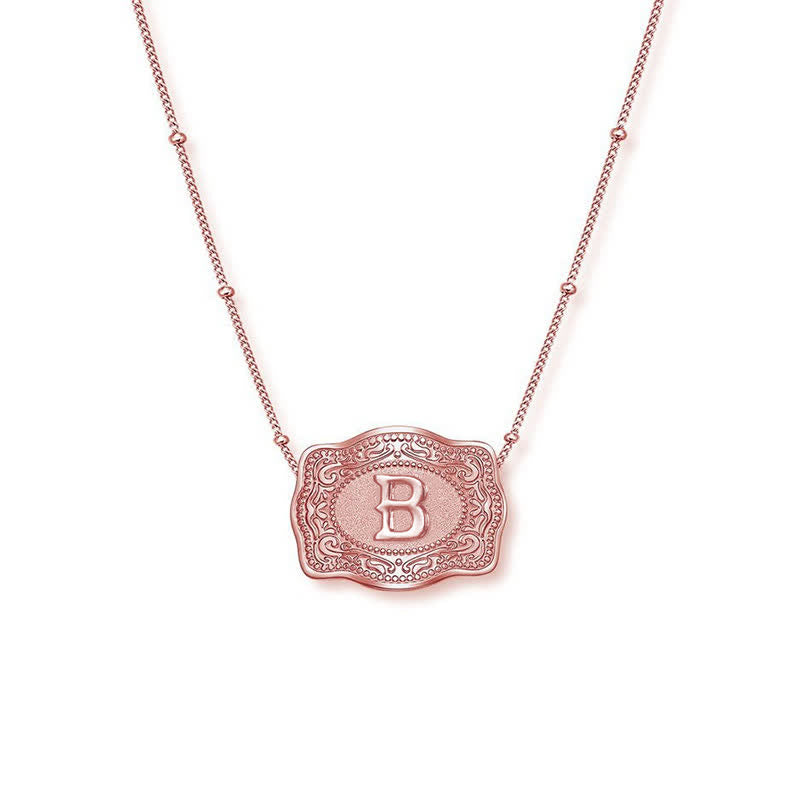 Collier mini lettre initiale en relief en or rose