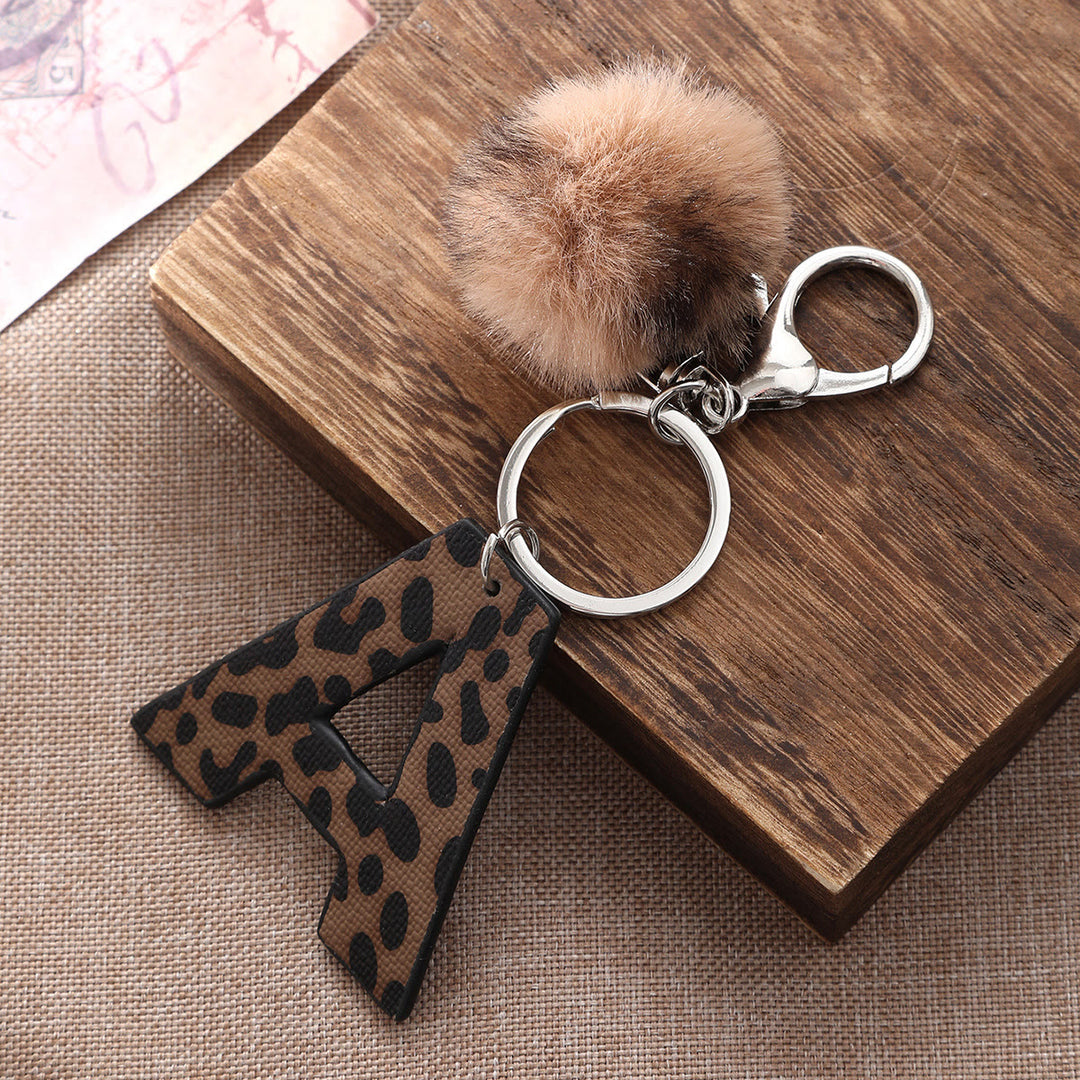 Porte-clés en cuir à imprimé léopard de style occidental avec boule en peluche - image 1
