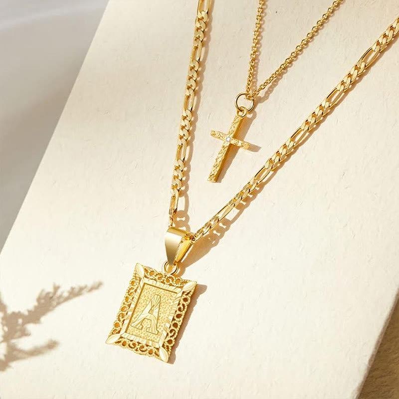 Collier double chaîne creux doré avec lettres carrées et croix - image 0
