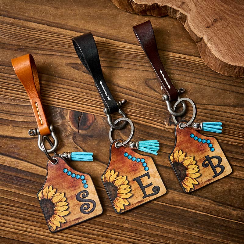 Porte-clés avec pendentif en forme de fer à cheval et imprimé de lettres de tournesols de l'Ouest - image 0