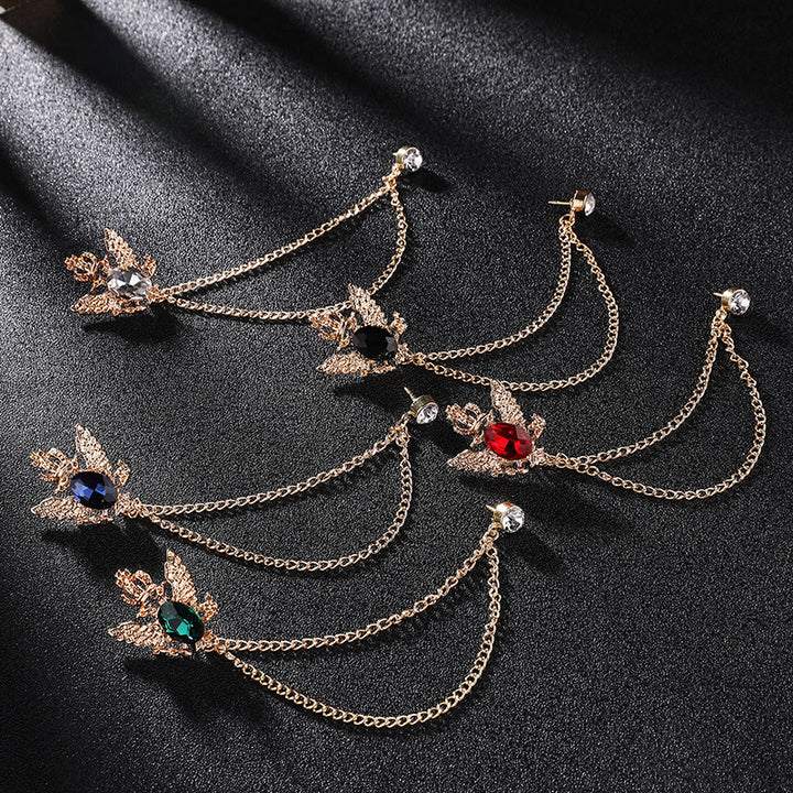 Broche rétro à double chaîne ornée d'un aigle et d'une couronne, rehaussée de pierres précieuses et d'un accent doré. - image 0