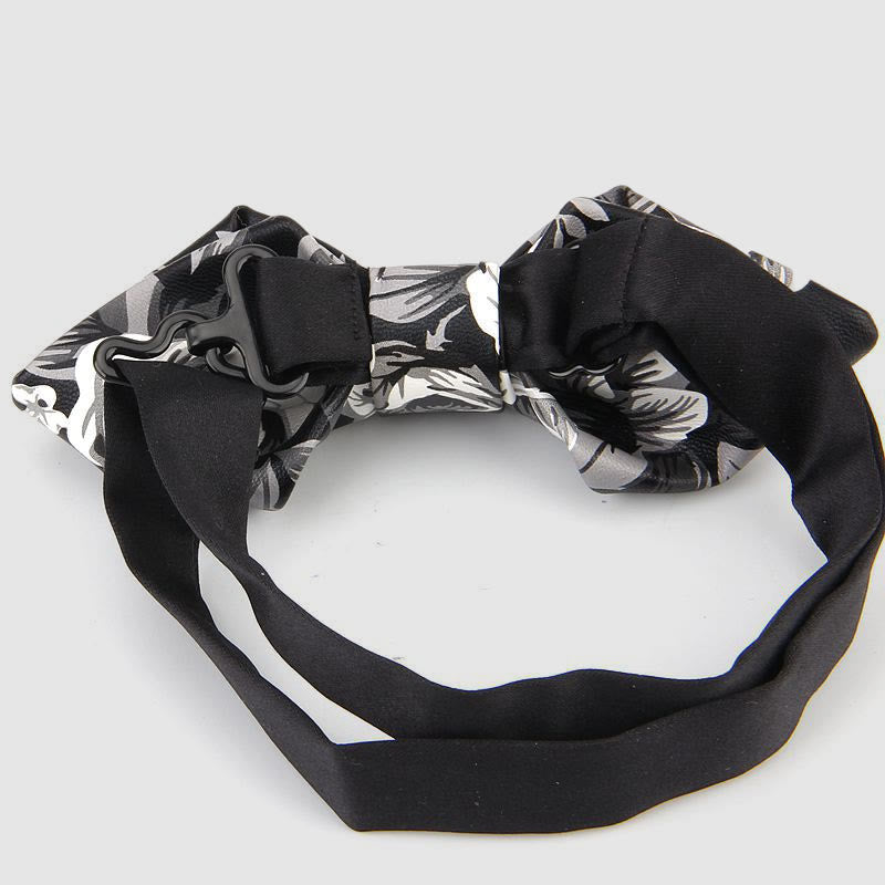 Nœud papillon pointu en cuir orné de motifs floraux et décoratifs - image 1