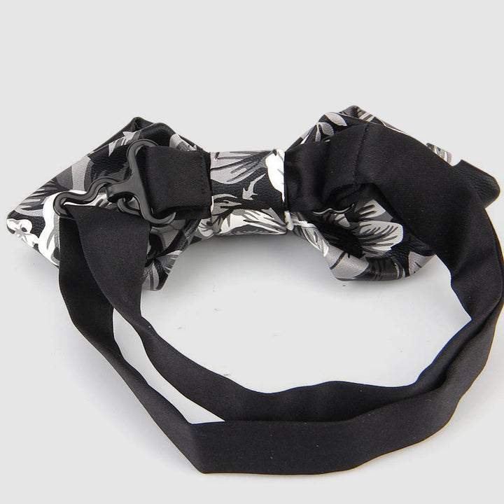 Nœud papillon pointu en cuir orné de motifs floraux et décoratifs - image 1