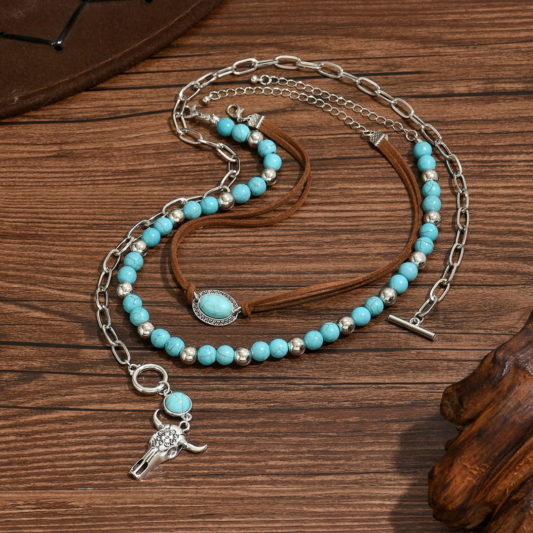 Collier style western avec perle turquoise et pendentif crâne de vache argenté - image 2