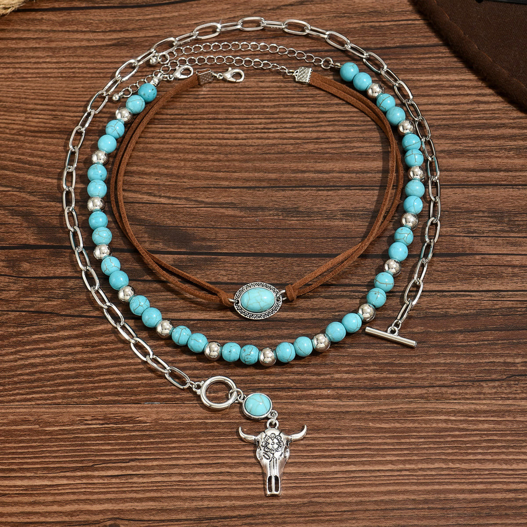 Collier style western avec perle turquoise et pendentif crâne de vache argenté - Bleu - image 0