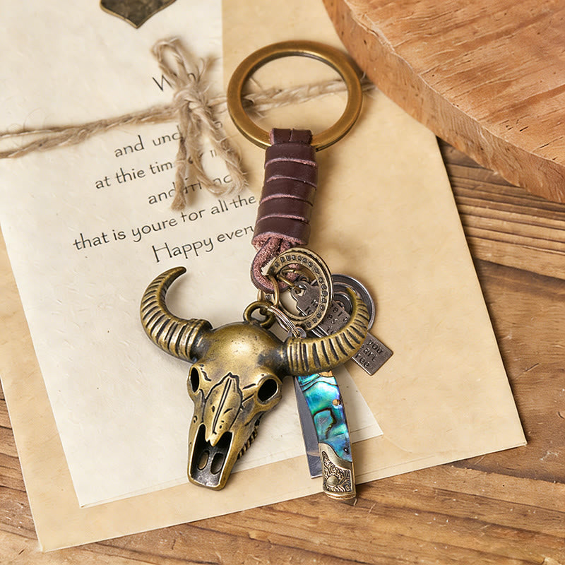 Porte-clés couteau pliant rétro avec pendentif tête de taureau et texture coquillage - image 1
