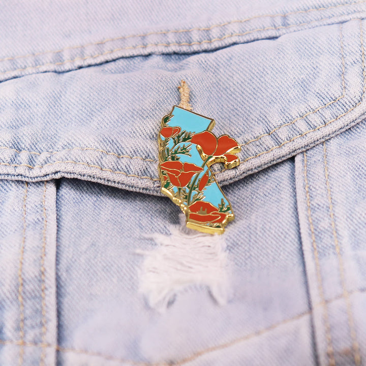 Broche émaillée dorée représentant le pavot de Californie - image 1