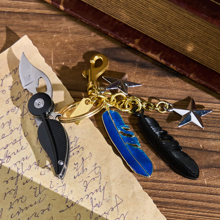 Porte-clés couteau créatif avec breloques en émail, pompon en plume et émail - image 1