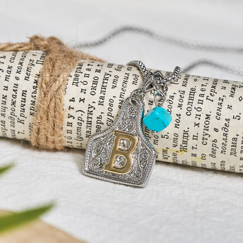 Collier pendentif turquoise bicolore style western - image 1