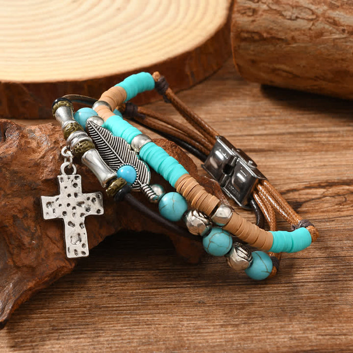 Bracelet en cuir superposé orné d'une croix turquoise et de plumes - Croix - image 0