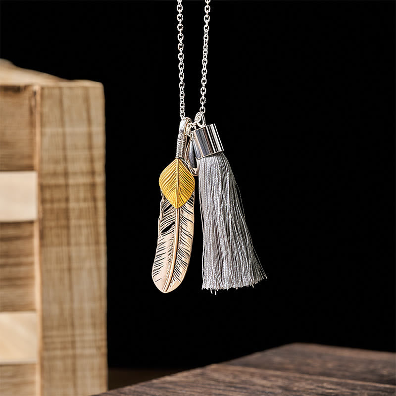 Collier vintage bohème en argent à pompon et plumes - image 1