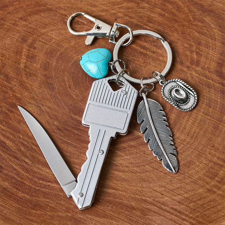 Porte-clés couteau pliant argenté avec pendentif turquoise et plume de style western - image 5